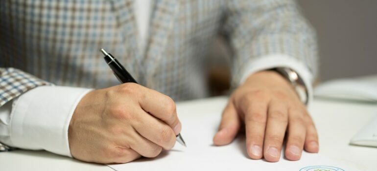 a man signing a contract