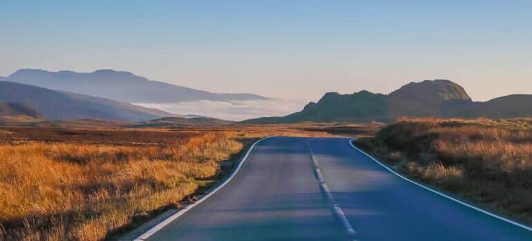 Open road with mountains in the background