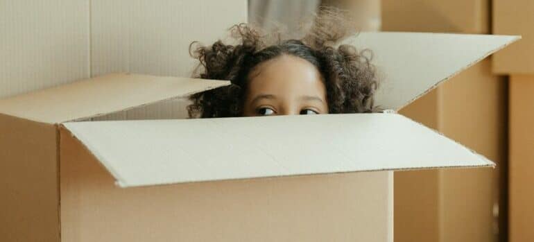 kid in a moving box
