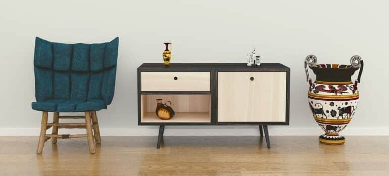 A chair, an end table, a vase.