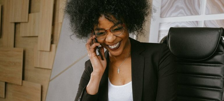 movers Hutto smiling and talking on the phone