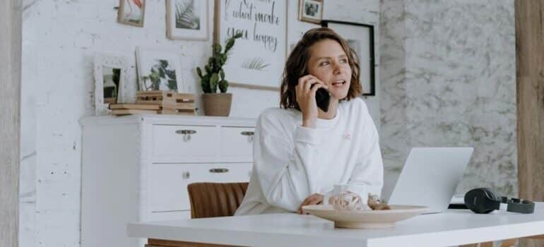 a woman calling the most reliable movers Leander can offer