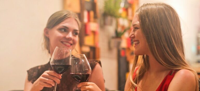 two females having a dinner in the restaurant,