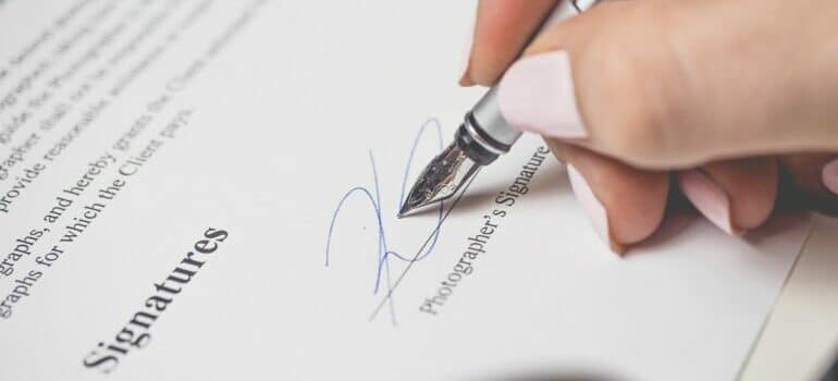 Person signing a contract