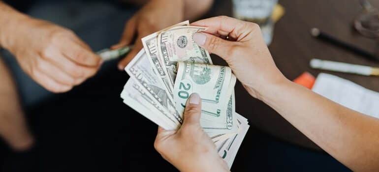person holding dollars in hands