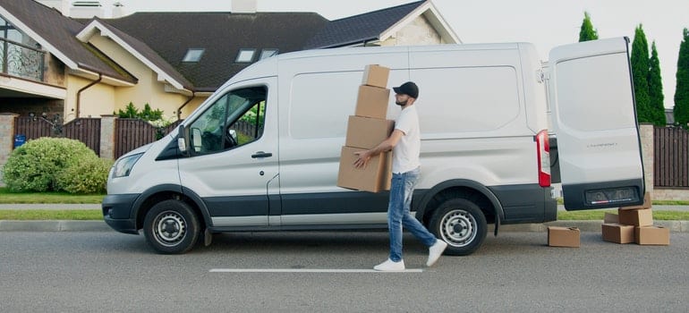 man unloading the moving van, bringing back the stuff from climate controlled storage Austin TX
