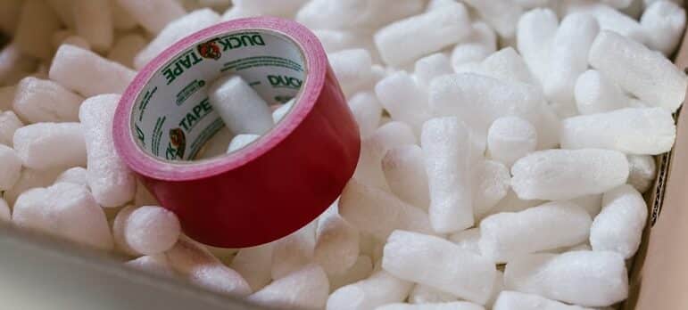 Styrofoam and packing tape inside a cardboard box