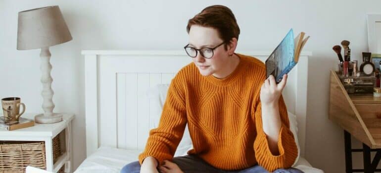 a girl on the bed, looking for student storage Austin offers