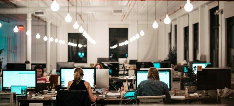 a group of employees working in an office