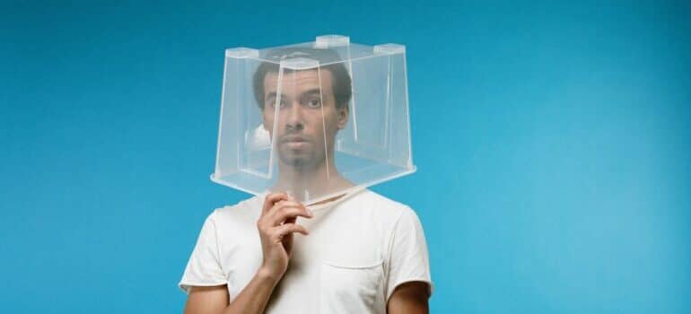 a man with a plastic box over his head