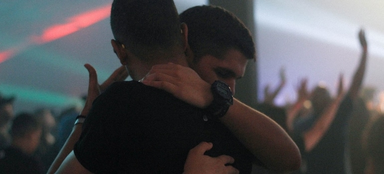 friends hugging after you break the news of your move