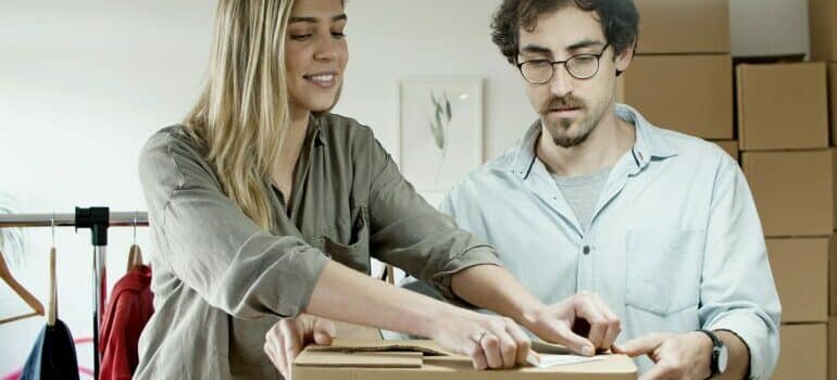 A couple packing belongings