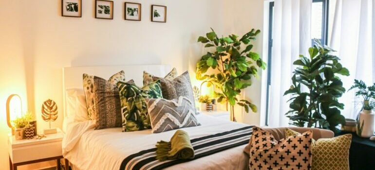 bedroom with plants and cozy pillows