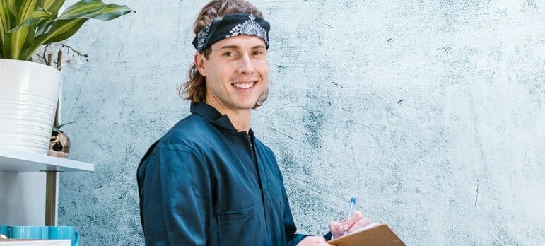 a man writing in a notebook