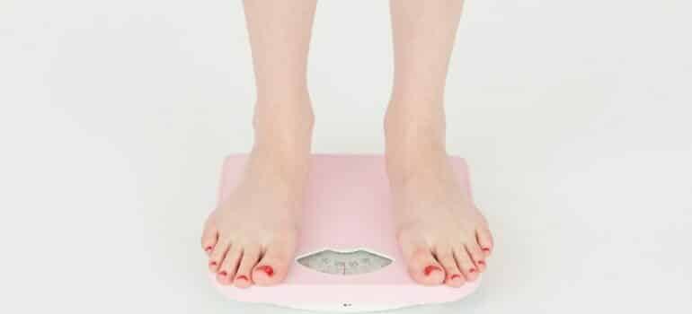 woman standing on a scale