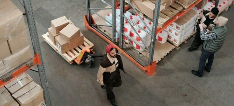 A man walking in a storage unit