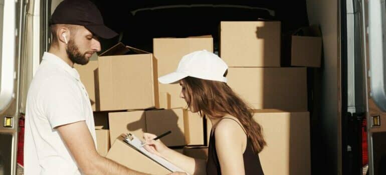 Professional mover helping with new home office layout items.