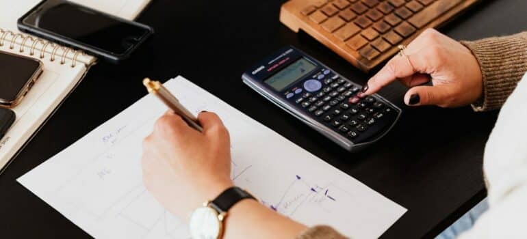 a woman going to calculate moving expenses