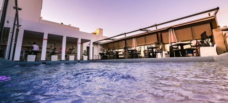 a pool alongside a bar at a hotel
