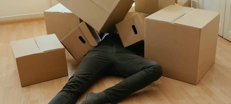 a person covered in cardboard boxes