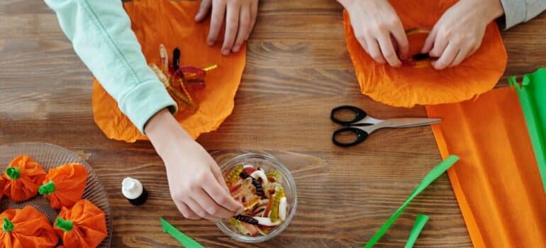 two people making Halloween decorations