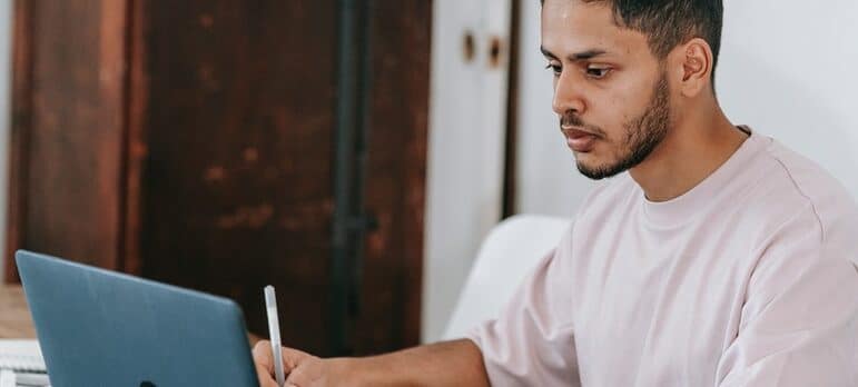 a man browsing laptop