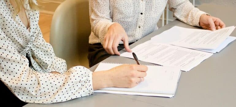 person signing a document