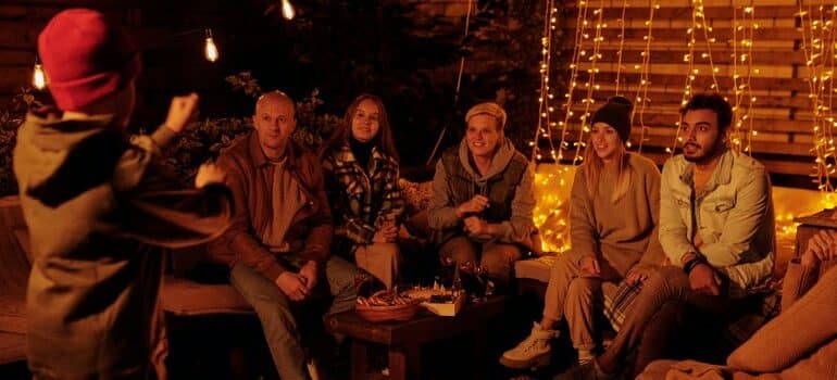 bunch of people playing guessing game at home