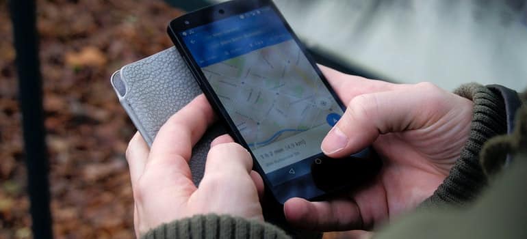 perosn looking on the phone location of the storage unit