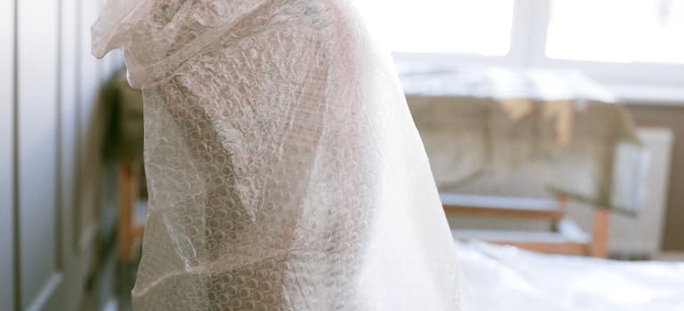 big item wrapped in plastic wrap