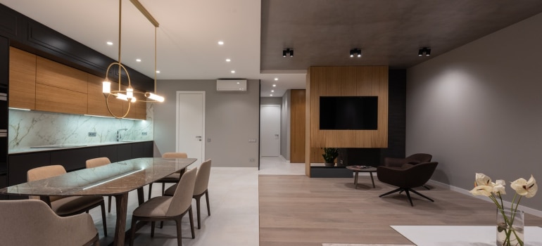 an inside view of the kitchen and living room in a luxury home