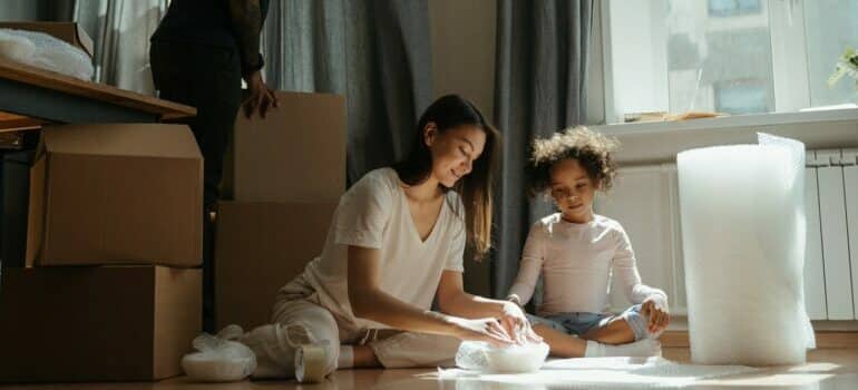 family packing child's room together