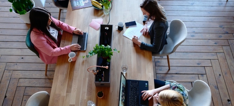 Women working on an office move on a deadline