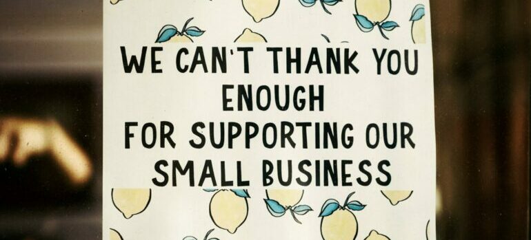 a poster with "We can't thank you enough for supporting our small business"