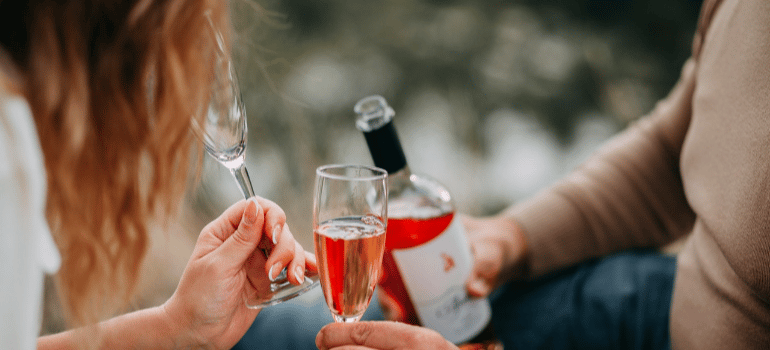 a couple drinking wine