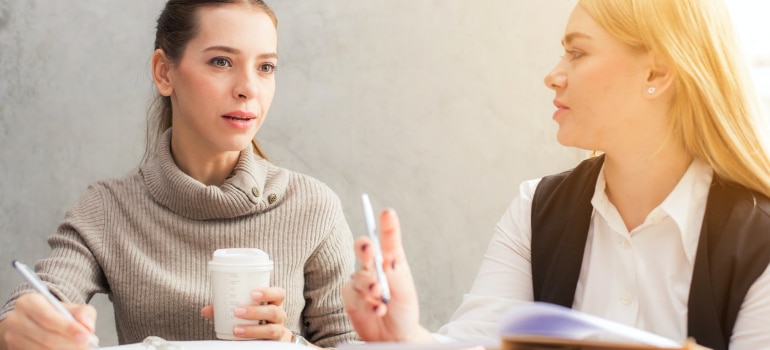 two women talking about creative ways to find house movers