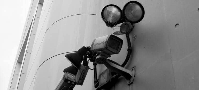 Security cameras and spotlights overwatching a storage unit