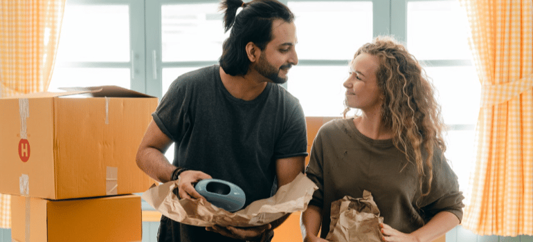 a man and a woman packing goods