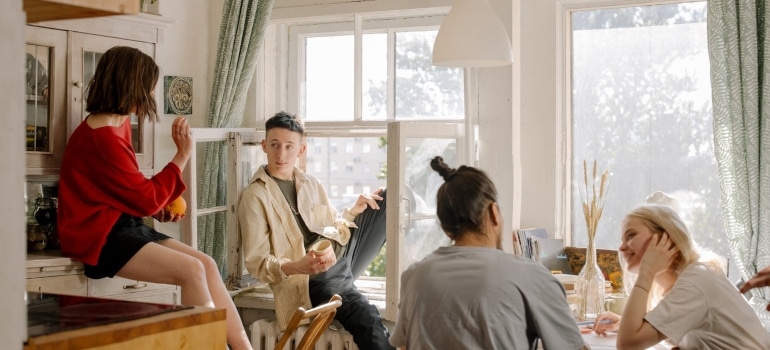 A group of students chatting in the room