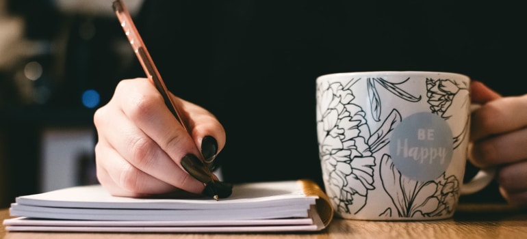 a person writing about Spring moving tips 