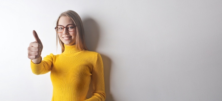 happy girl in yellow turtleneck