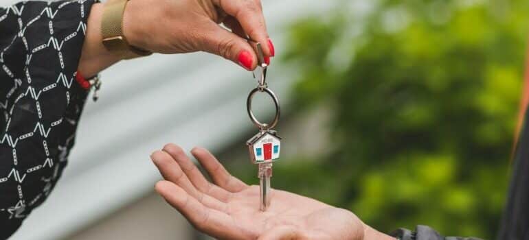 person giving away keys