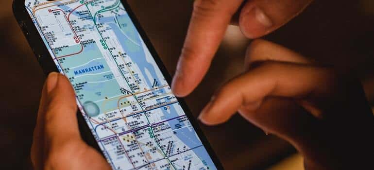 People looking at a mpa on the phone