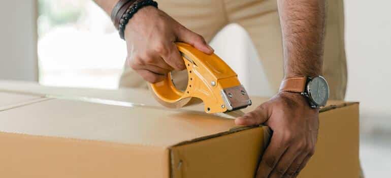 A person packing for storage