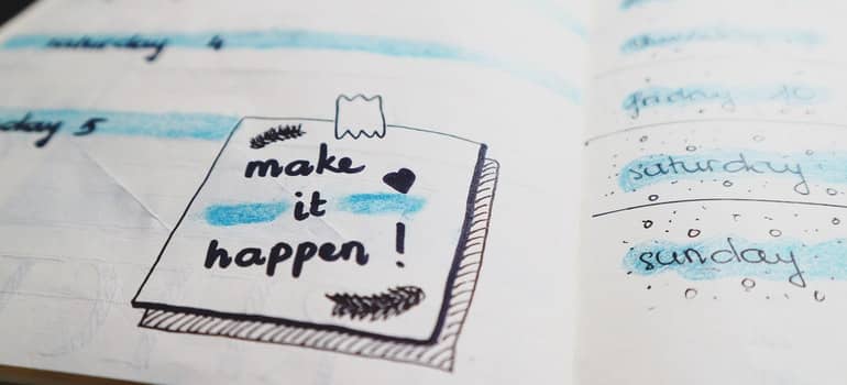 White paper with a note that has make it happen;