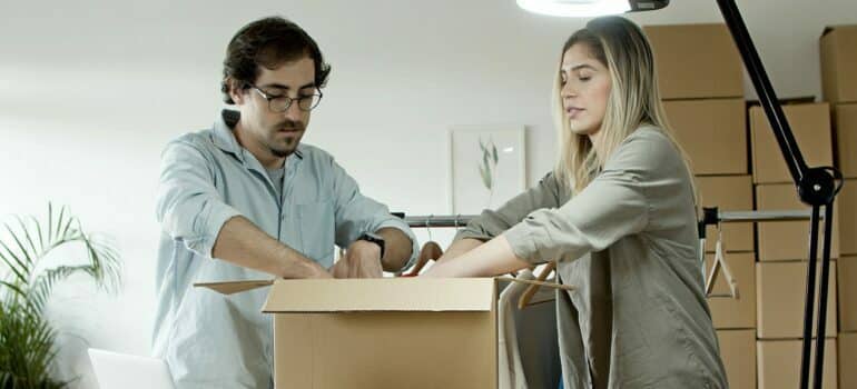 A couple packing their things