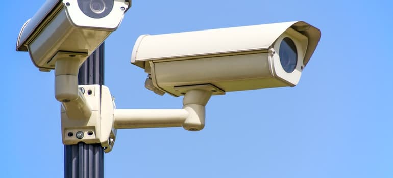 Two CCTV cameras mounted on post;