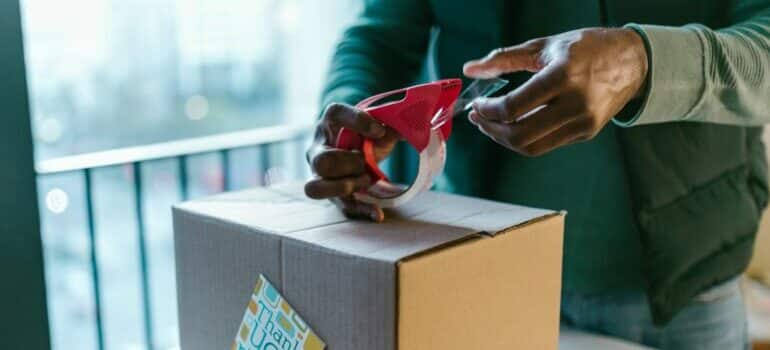 A man preparing his items for temporary storage when moving out of state