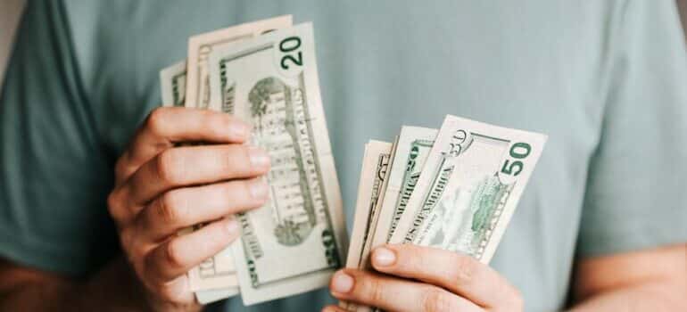 Person holding and counting the money