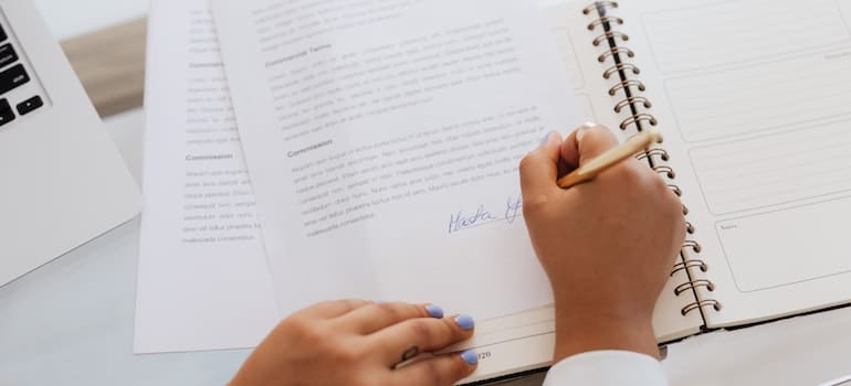 Person Signing a Contract.